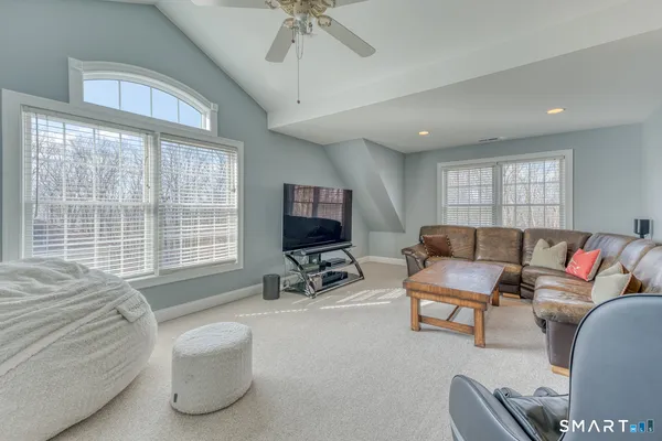 a view of walk in closet with clothes