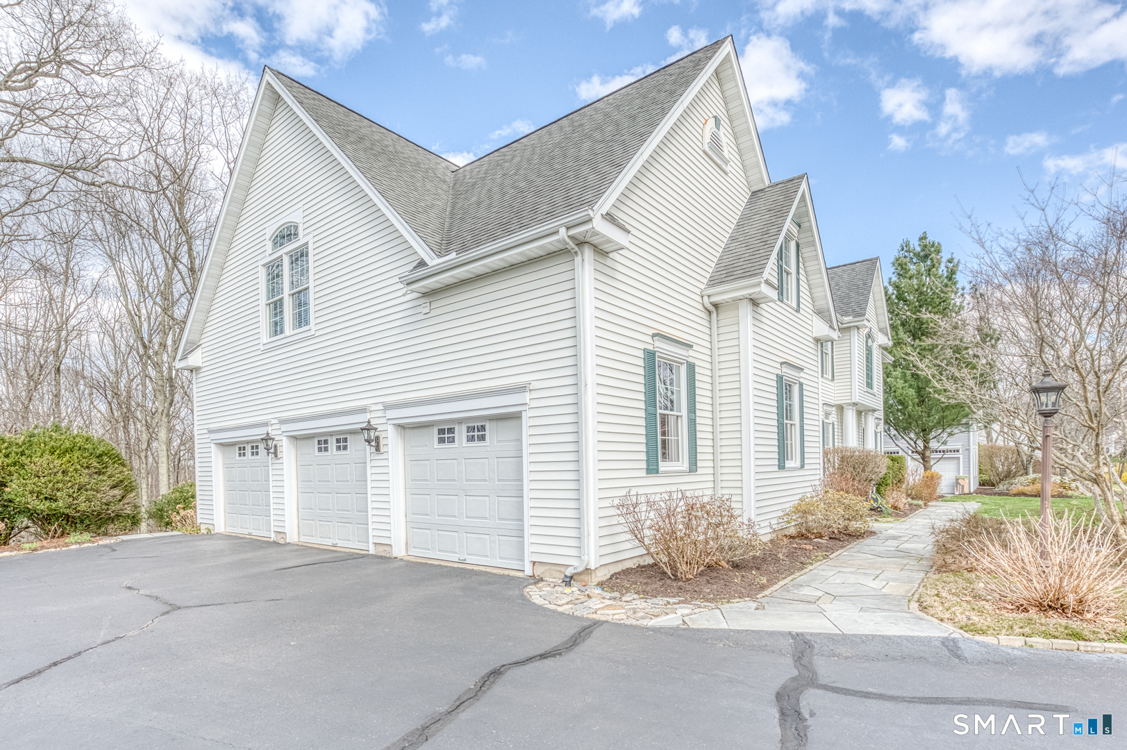 133 Feldspar Ridge Glastonbury, CT 06033 - Photo 7 of 56 a front view of a house with a yard and garage