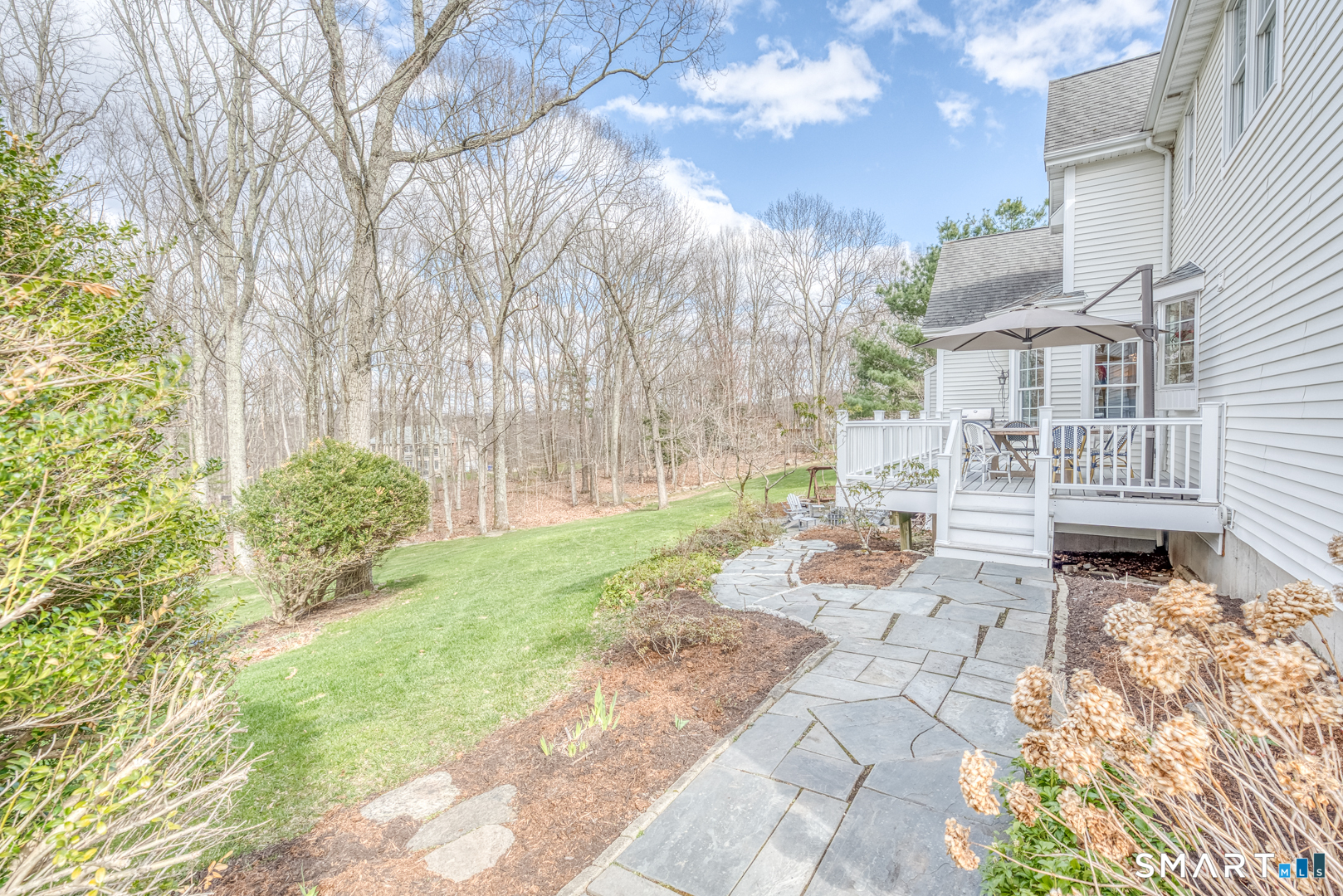 133 Feldspar Ridge Glastonbury, CT 06033 - Photo 8 of 56 a view of a yard with plants and large trees