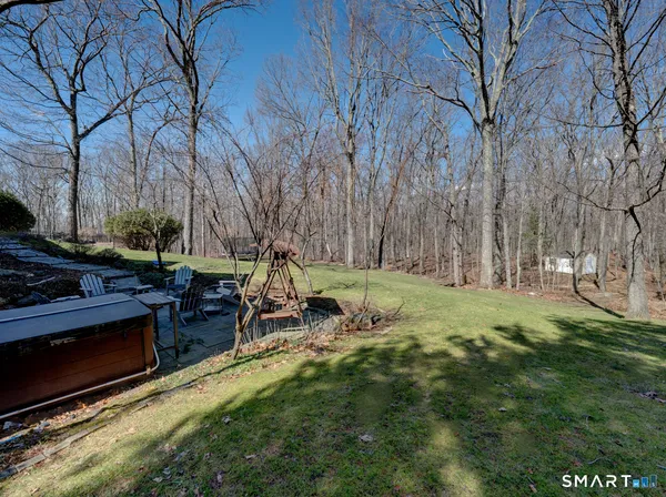 a backyard of apartments with large trees