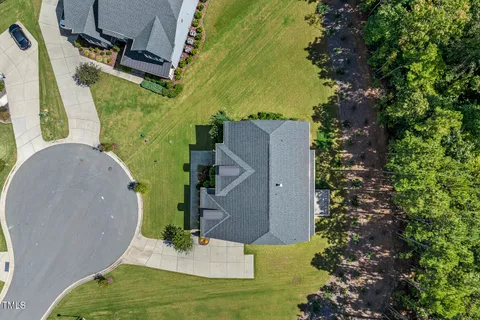 a kitchen with granite countertop white cabinets and stainless steel appliances