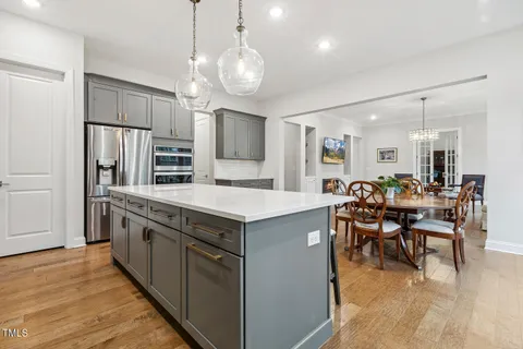 a bathroom with a tub sink a mirror a shower and vanity