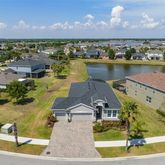 an aerial view of a house with a ocean view