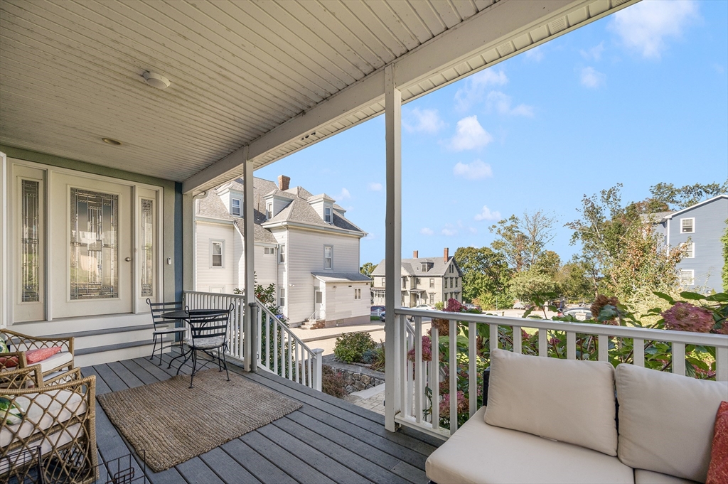 267 Lincoln Avenue Fall River, MA 02720 - Photo 12 of 41 a balcony with wooden floor and outdoor seating