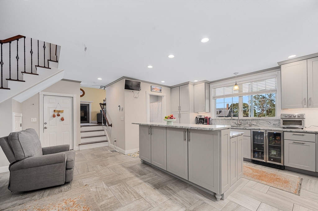267 Lincoln Avenue Fall River, MA 02720 - Photo 13 of 41 a kitchen with stainless steel appliances kitchen island granite countertop a refrigerator and a sink