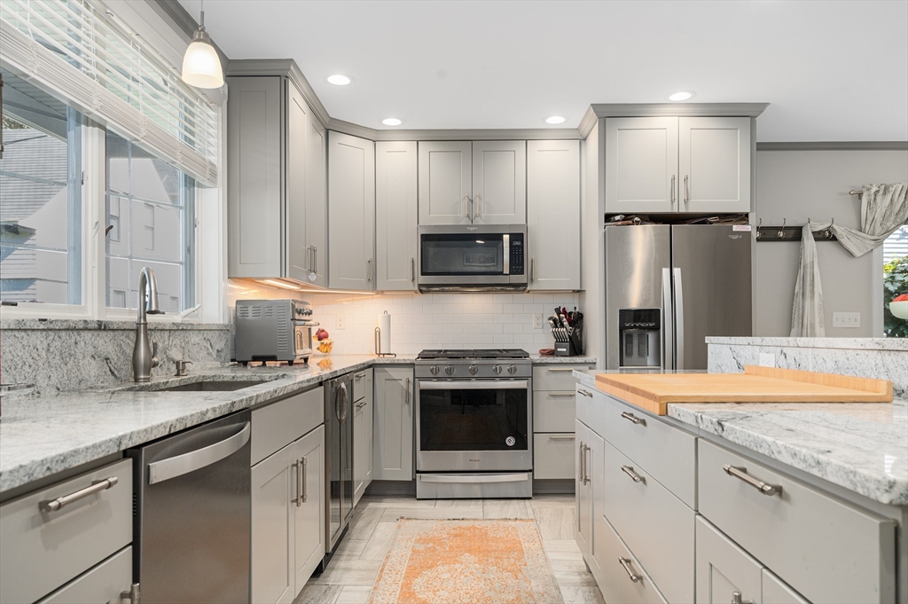 267 Lincoln Avenue Fall River, MA 02720 - Photo 15 of 41 a kitchen with a sink stove and refrigerator