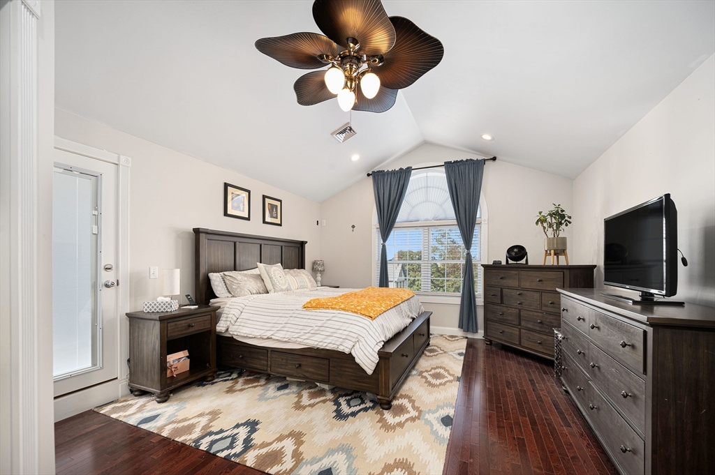 267 Lincoln Avenue Fall River, MA 02720 - Photo 32 of 41 a bedroom with a bed and a flat tv screen on a dresser