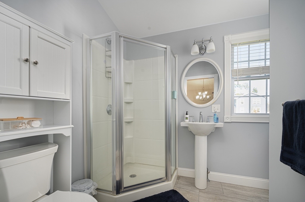 267 Lincoln Avenue Fall River, MA 02720 - Photo 34 of 41 a bathroom with a sink a mirror a vanity and a window
