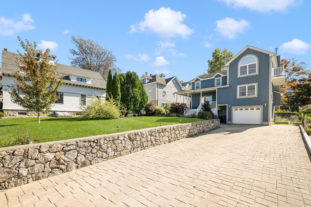 267 Lincoln Avenue Fall River, MA 02720 - Photo 4 of 41 a front view of a house with a yard and potted plants