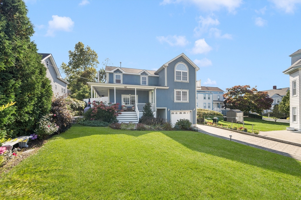 267 Lincoln Avenue Fall River, MA 02720 - Photo 6 of 41 a front view of a house with a yard and garage