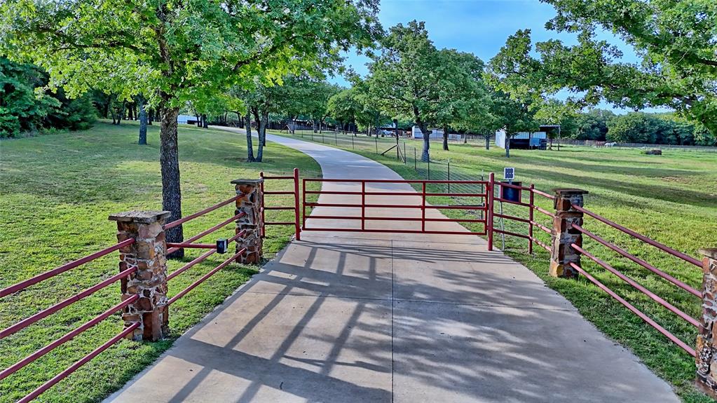 4509 Lazy E Road St. Jo, TX 76265 - Photo 1 of 39 a view of a park with large trees