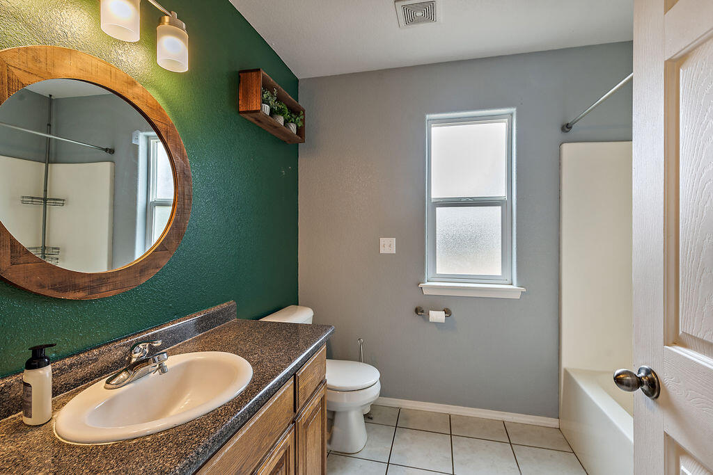 167 Rippling Way Merlin, OR 97532 - Photo 8 of 39 a bathroom with a toilet sink and mirror