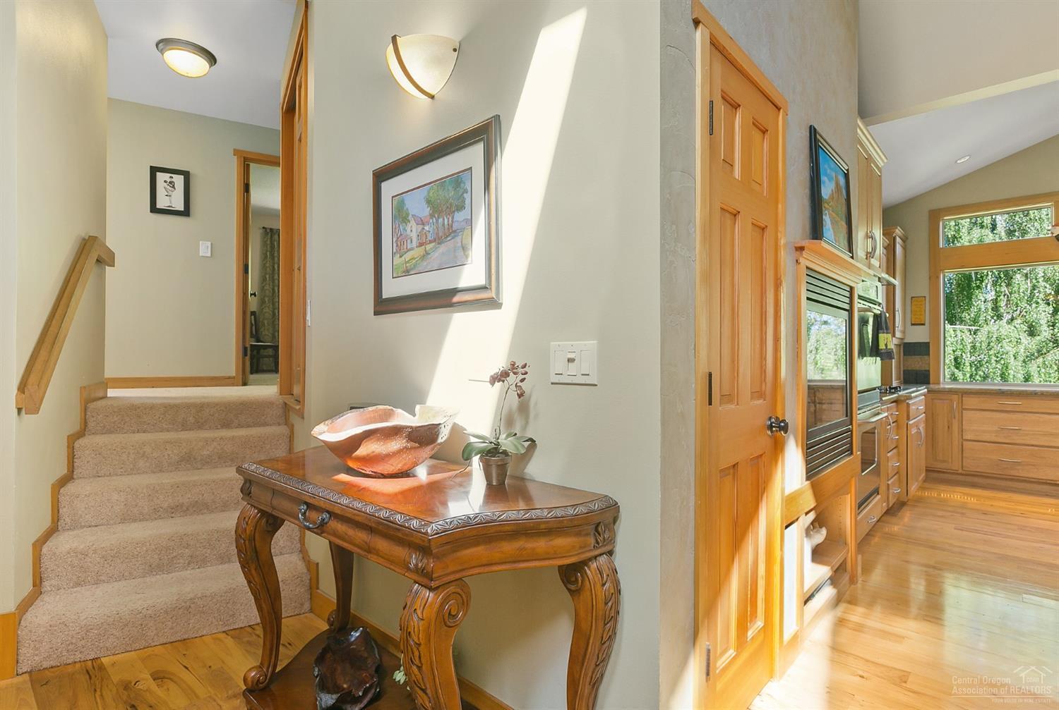 21210 Yeoman Road Bend, OR 97701 - Photo 10 of 25 a view of a dining room with furniture and a window