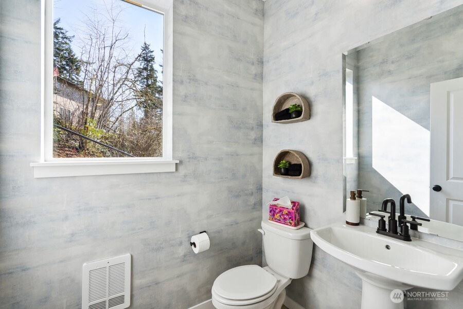 4249 Aberdeen Way Northeast Renton, WA 98056 - Photo 22 of 38 a bathroom with a sink mirror toilet and bathroom view
