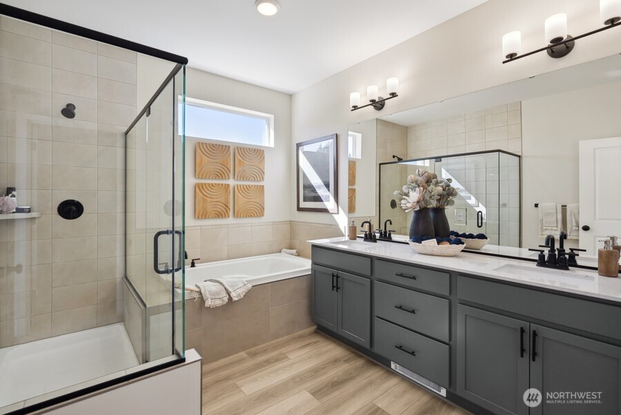 4249 Aberdeen Way Northeast Renton, WA 98056 - Photo 26 of 38 a bathroom with a double vanity sink a mirror a glass door a shower and a mirror