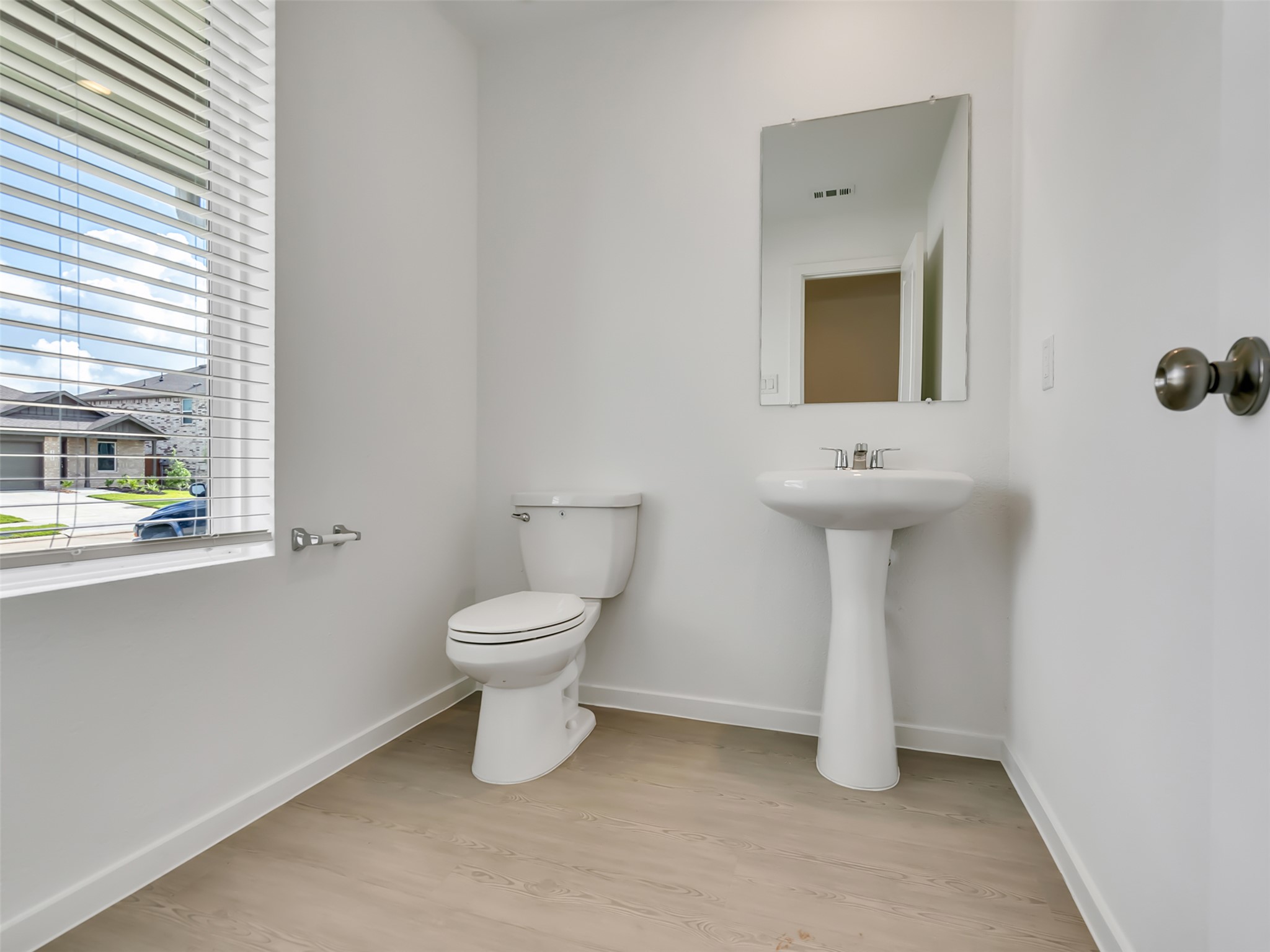 3041 Colusa Rdg Drive Katy, TX 77493 - Photo 8 of 26 a bathroom with a toilet sink and mirror