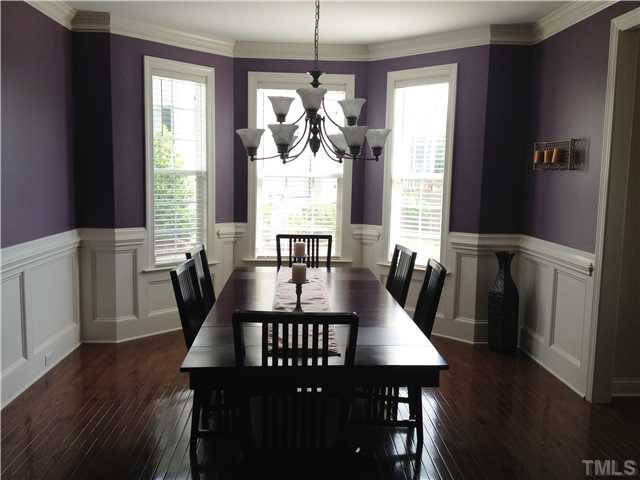 3614 Silver Forrest Lane Raleigh, NC 27614 - Photo 5 of 25 The dining room is open to the entry hallway and also accessible to the kitchen, The bay window looks out on the side yard. The wainscoting, crown molding, and hardwoods add to the elegance of the room. Dining Room