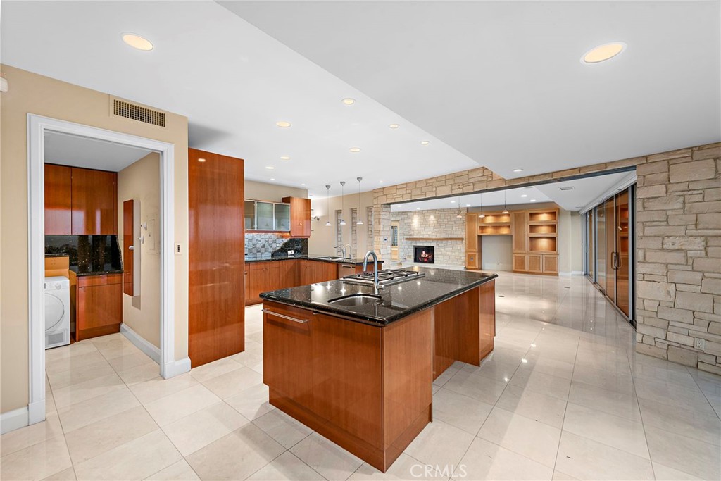 2801 Setting Sun Drive Corona del Mar, CA 92625 - Photo 11 of 30 a kitchen with stainless steel appliances granite countertop a stove and a sink