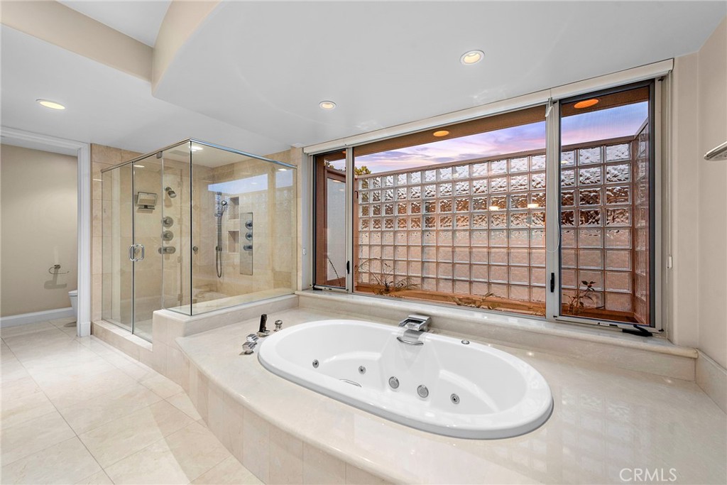 2801 Setting Sun Drive Corona del Mar, CA 92625 - Photo 18 of 30 a bathroom with a bathtub and a shower