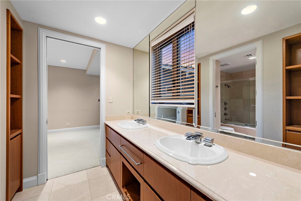 2801 Setting Sun Drive Corona del Mar, CA 92625 - Photo 22 of 30 a bathroom with a sink double vanity and a mirror