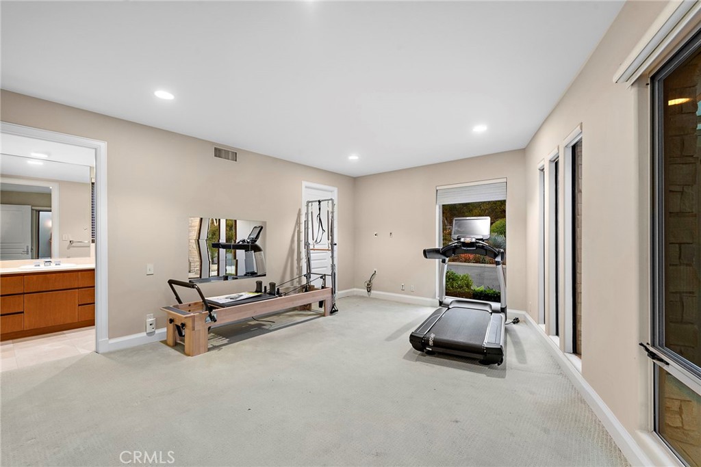 2801 Setting Sun Drive Corona del Mar, CA 92625 - Photo 25 of 30 a living room with furniture and a flat screen tv