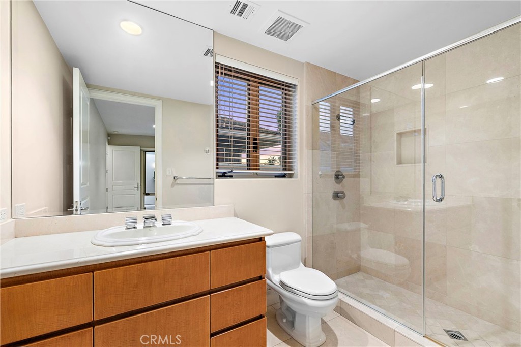2801 Setting Sun Drive Corona del Mar, CA 92625 - Photo 26 of 30 a bathroom with a sink a toilet and shower