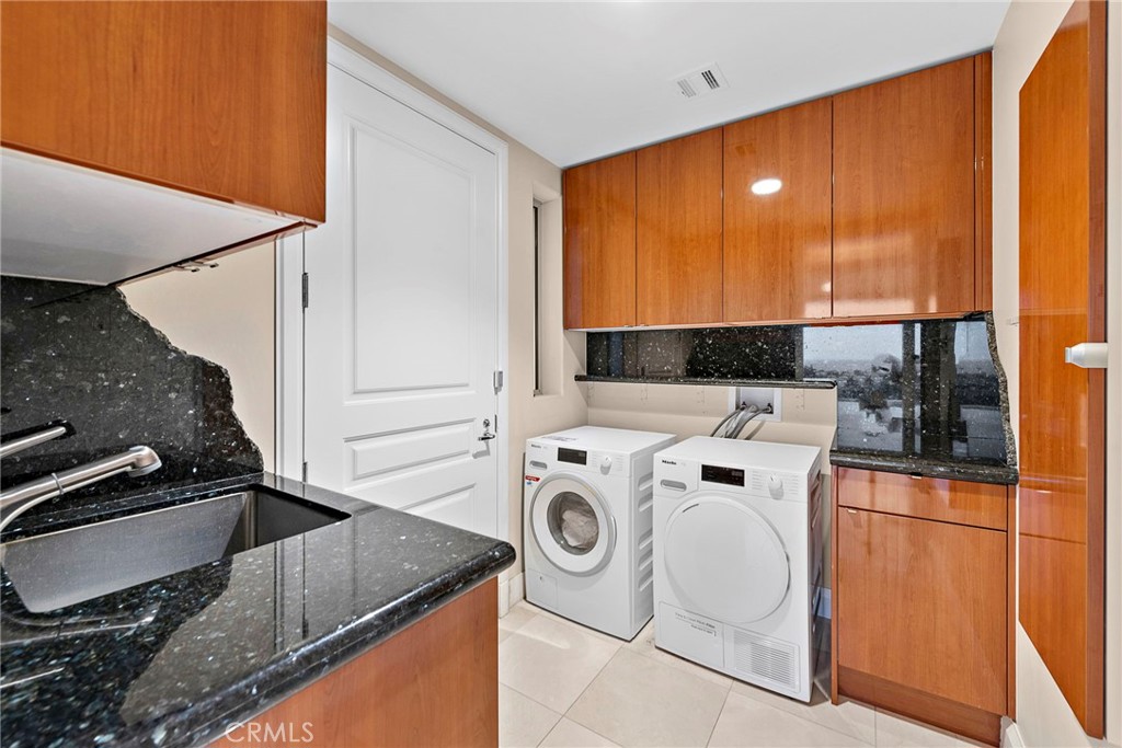2801 Setting Sun Drive Corona del Mar, CA 92625 - Photo 27 of 30 a utility room with dryer and washer