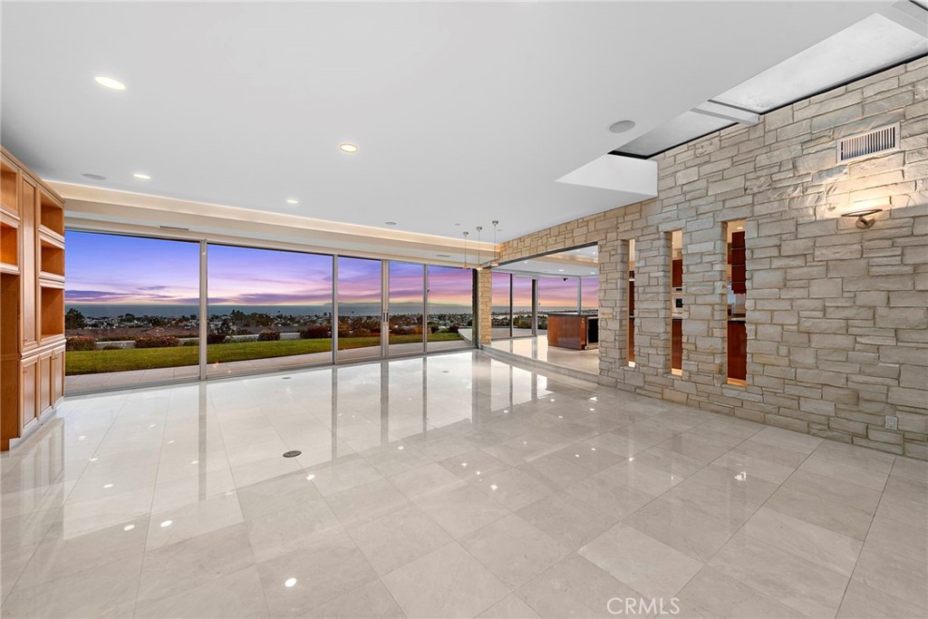 2801 Setting Sun Drive Corona del Mar, CA 92625 - Photo 6 of 30 a view of an empty room with a floor to ceiling window