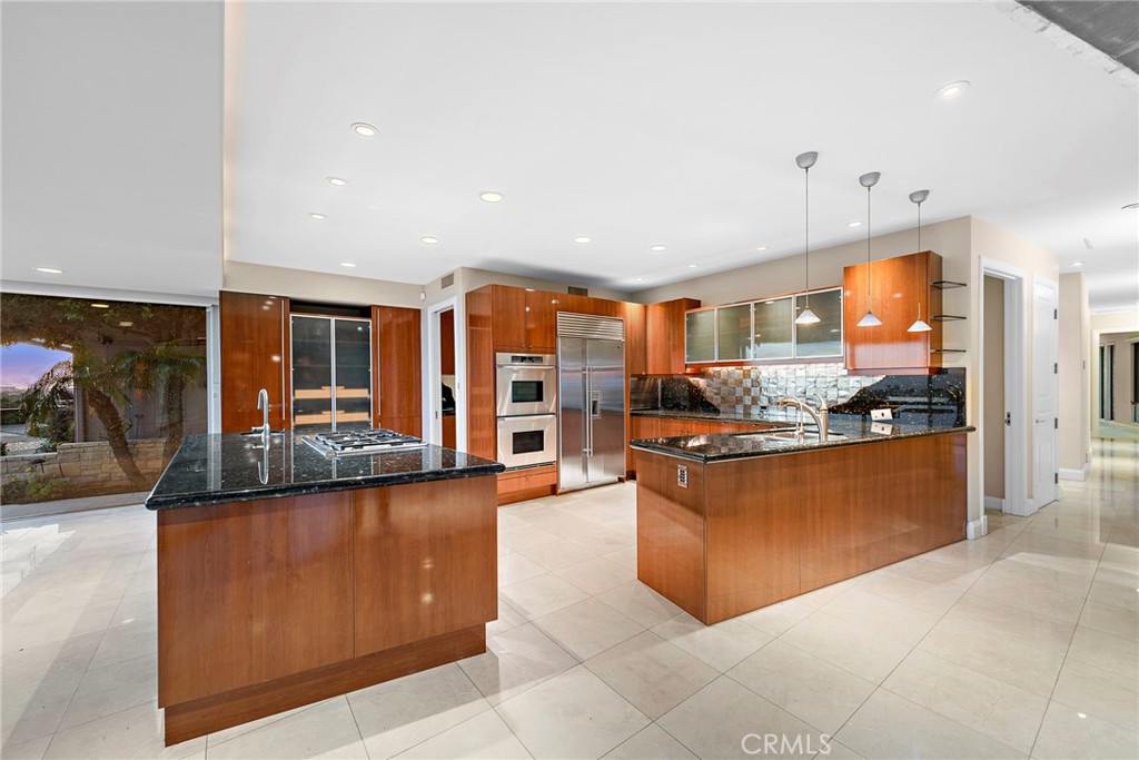 2801 Setting Sun Drive Corona del Mar, CA 92625 - Photo 10 of 30 a large kitchen with stainless steel appliances lots of counter top space