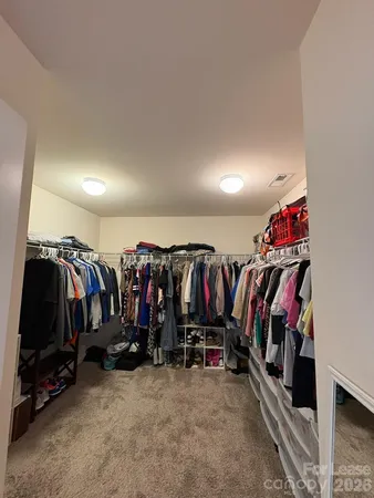 a view of a closet with storage