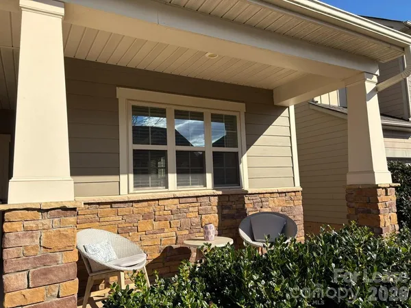a front view of a house with a porch