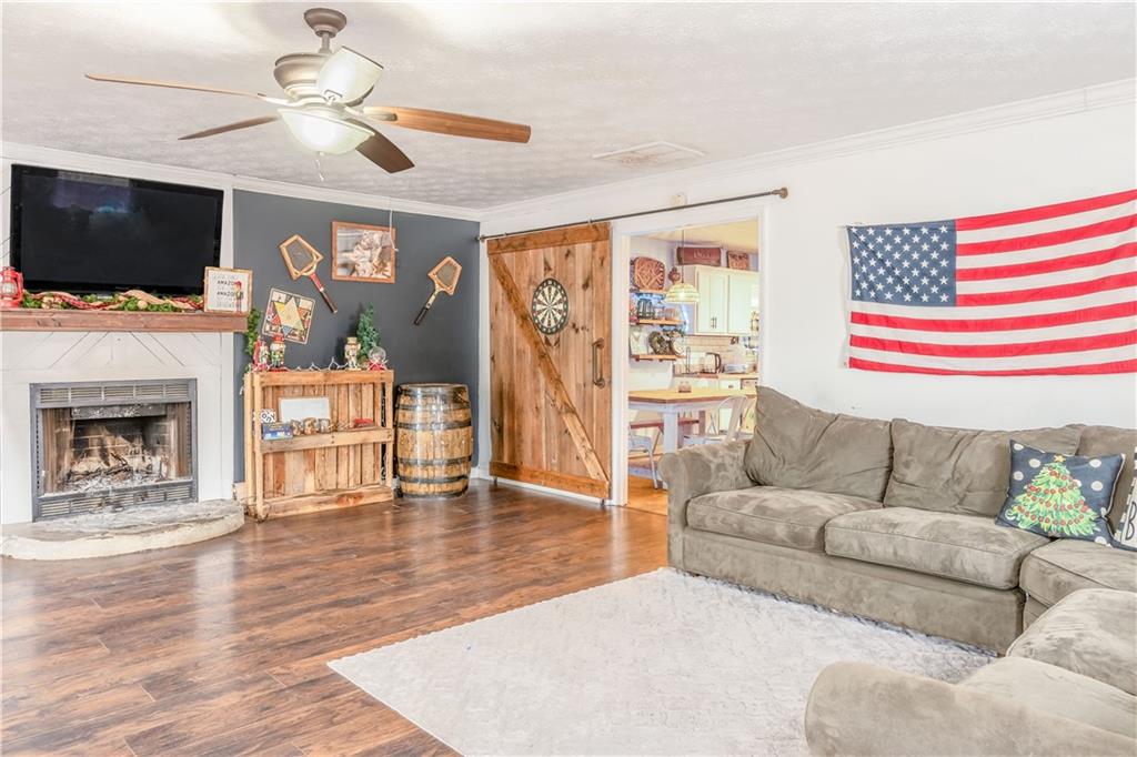 1280 Ragan Road Douglasville, GA 30134 - Photo 15 of 33 a living room with furniture fireplace and flat screen tv