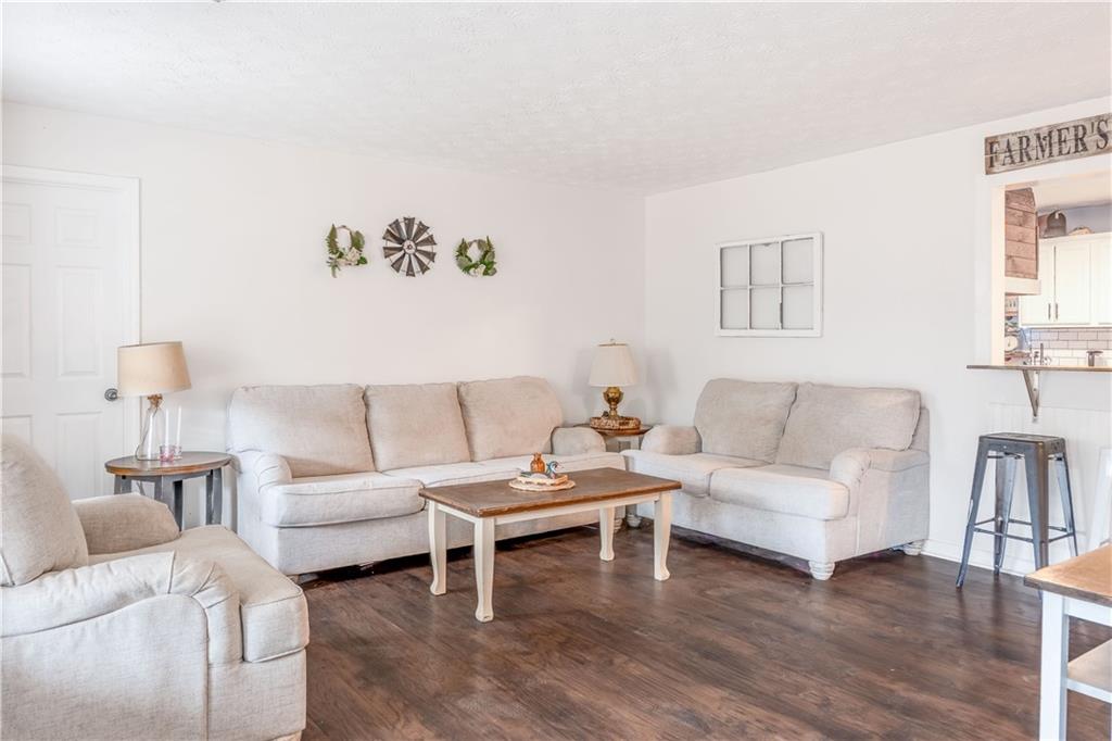 1280 Ragan Road Douglasville, GA 30134 - Photo 8 of 33 a living room with furniture and a couch