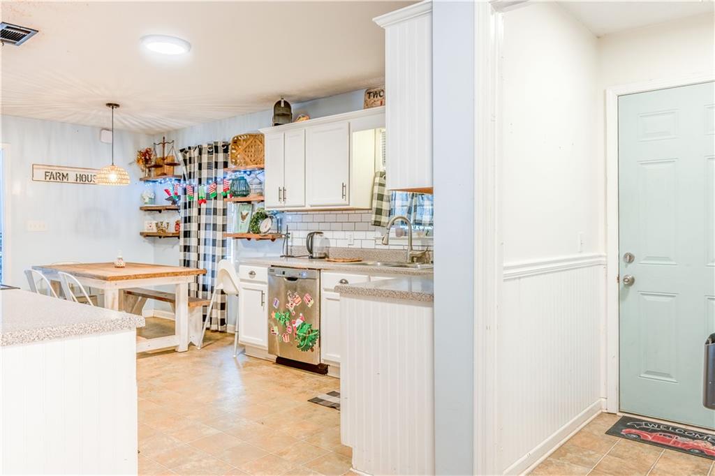 1280 Ragan Road Douglasville, GA 30134 - Photo 10 of 33 a kitchen with appliances a sink and cabinets