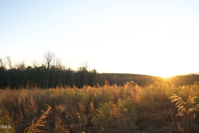 a kitchen with kitchen island granite countertop a sink stove and cabinets
