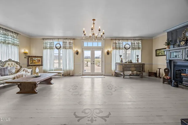 a view of a livingroom with a window and furniture