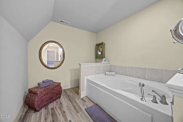 a bathroom with a sink a toilet and bathtub
