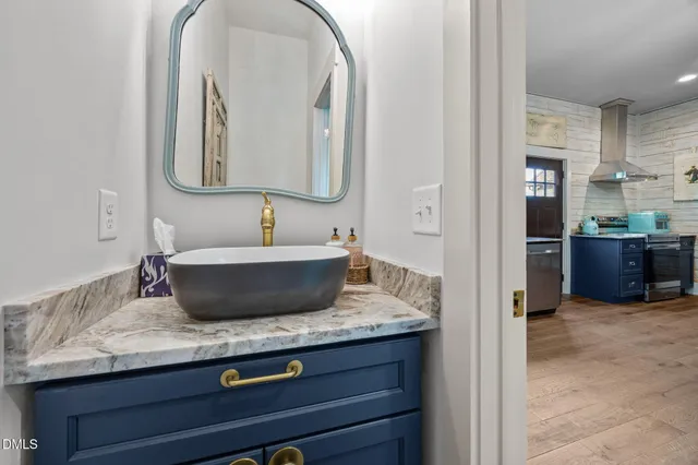 a view of a house with a yard and sitting area