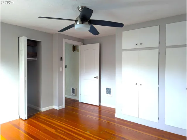 a view of a livingroom with wooden floor