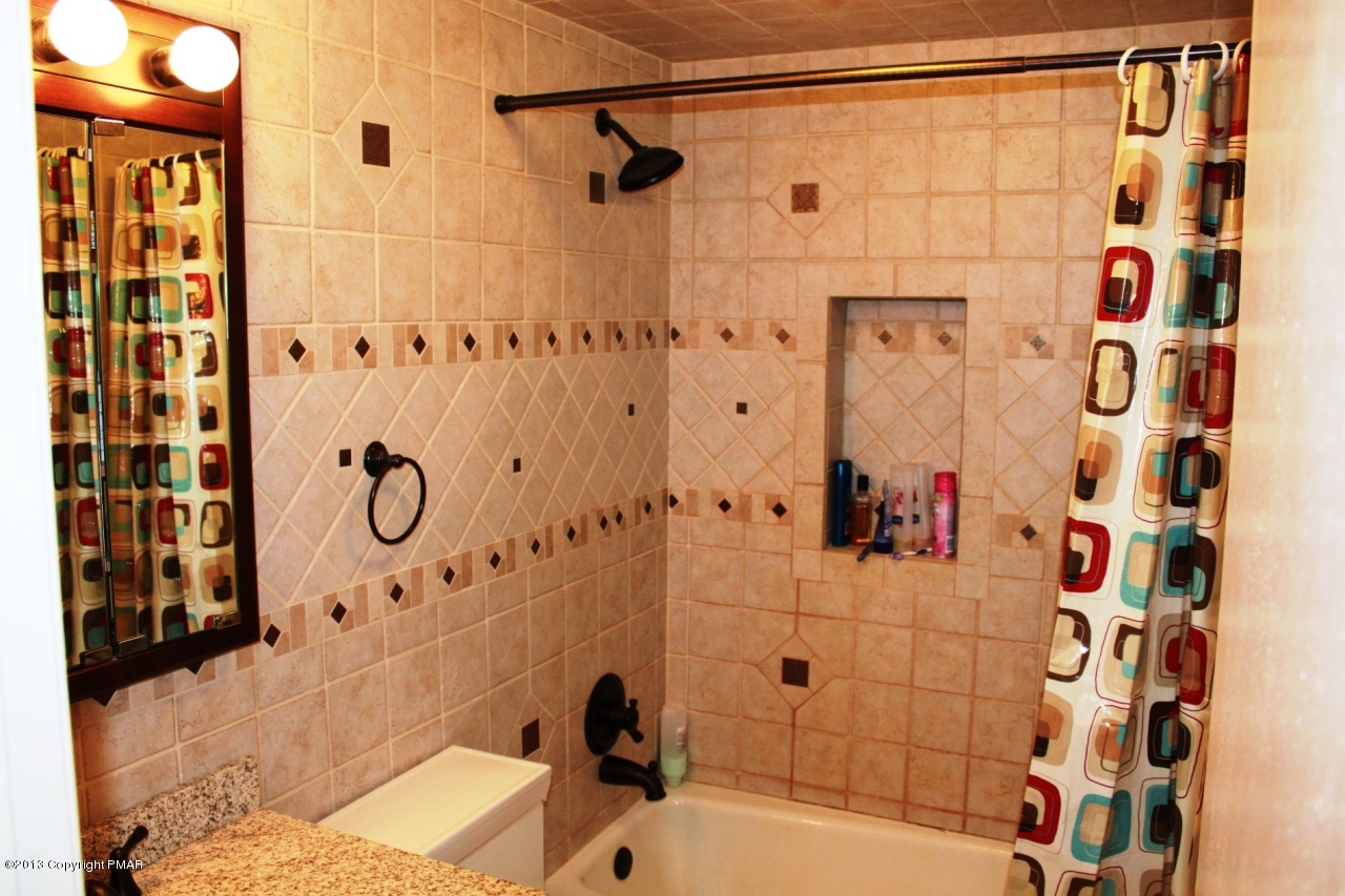 1449 Clover Road Long Pond, PA 18334 - Photo 10 of 29 a bathroom with a bathtub and shower