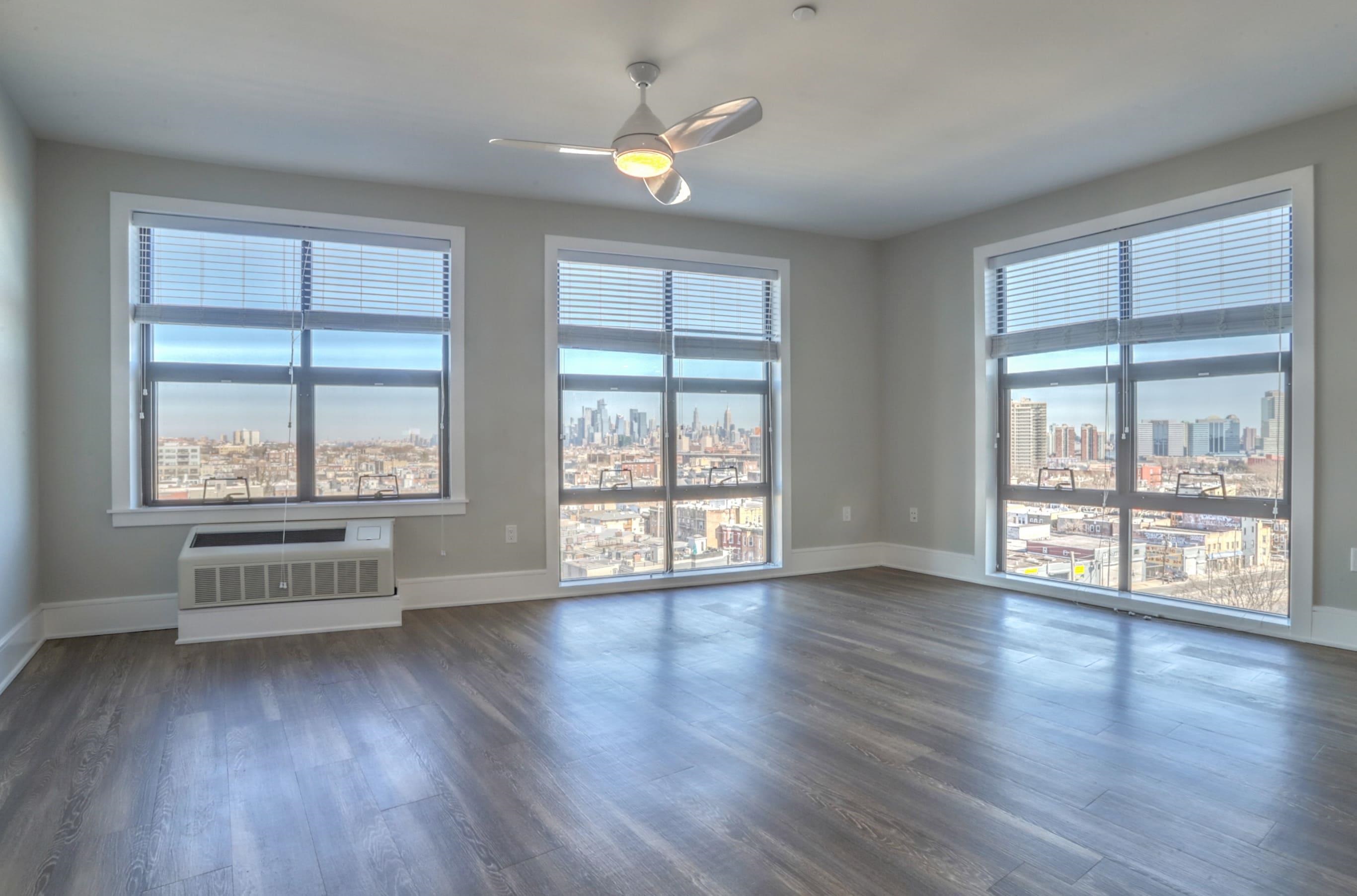 wooden floor in an empty room with a window