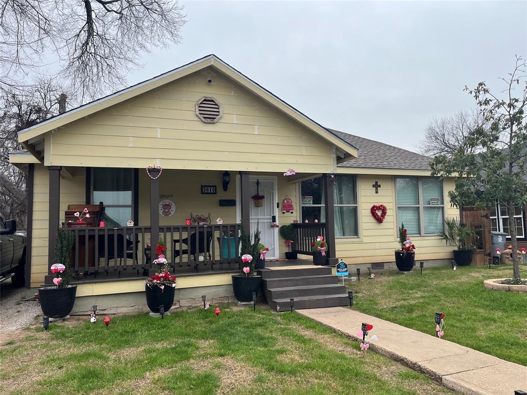 a front view of house with outdoor seating