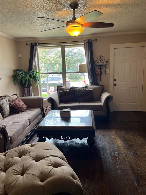 3610 Bertrand Avenue Dallas, TX 75210 - Photo 4 of 10 a living room with furniture and a large window