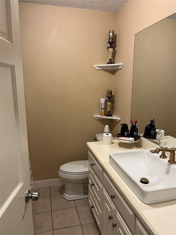 3610 Bertrand Avenue Dallas, TX 75210 - Photo 7 of 10 a bathroom with a sink and a toilet