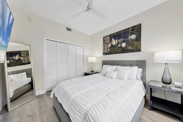 a bedroom with a bed and a lamp