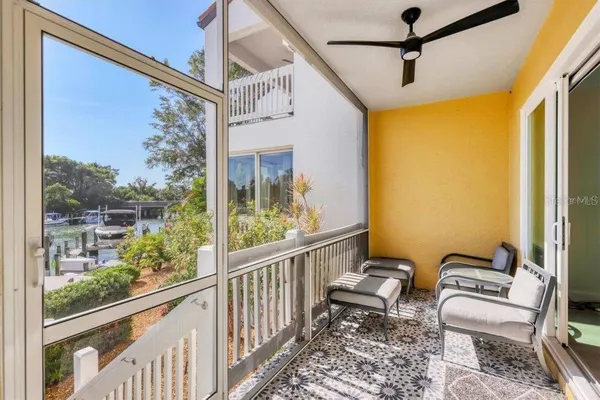 a view of a balcony with furniture