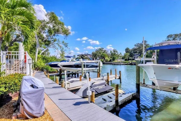 a view of a house with swimming pool and sitting area