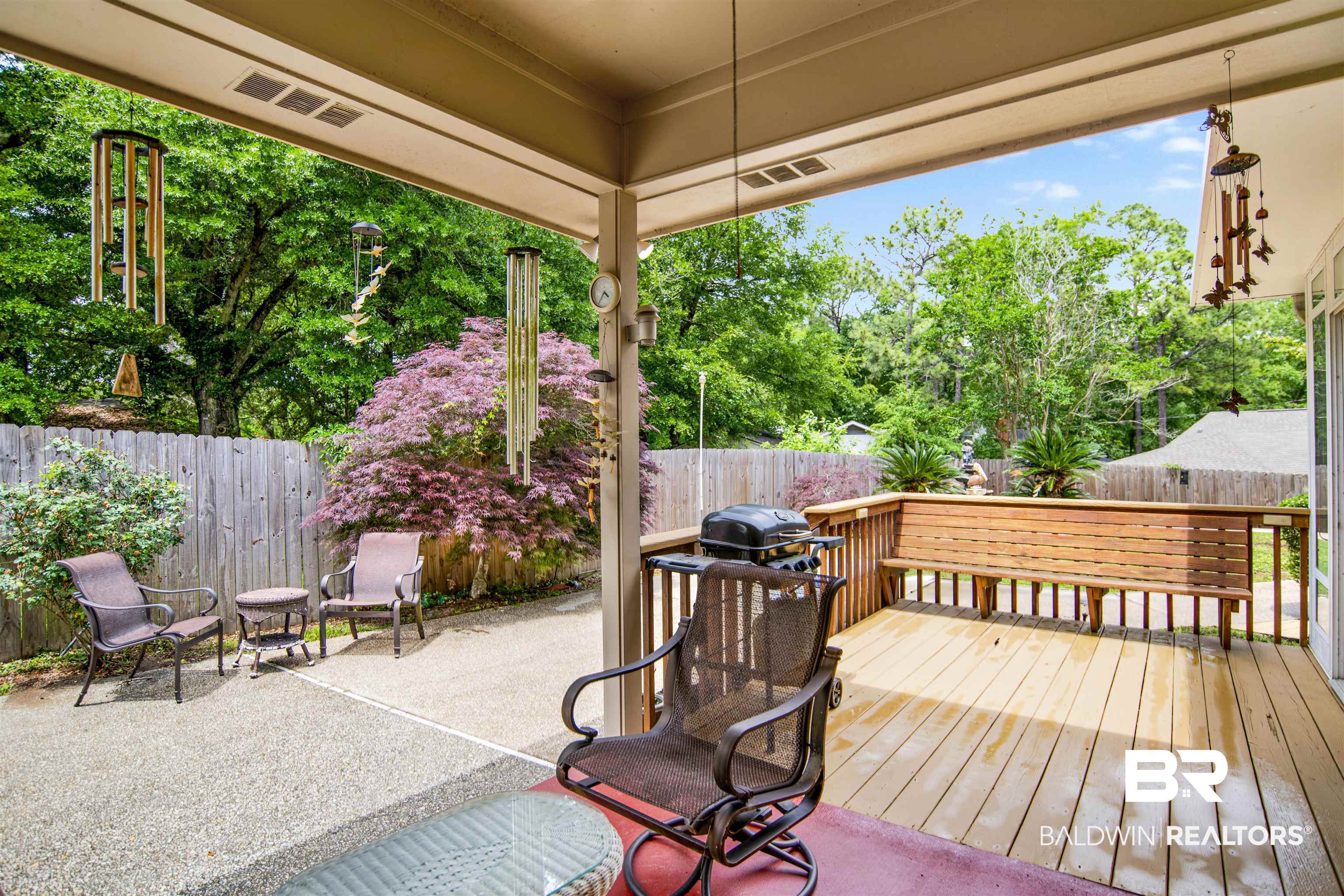 107 Virginia Circle Daphne, AL 36526 - Photo 29 of 47 Covered patio featuring a wood deck with a built-in bench