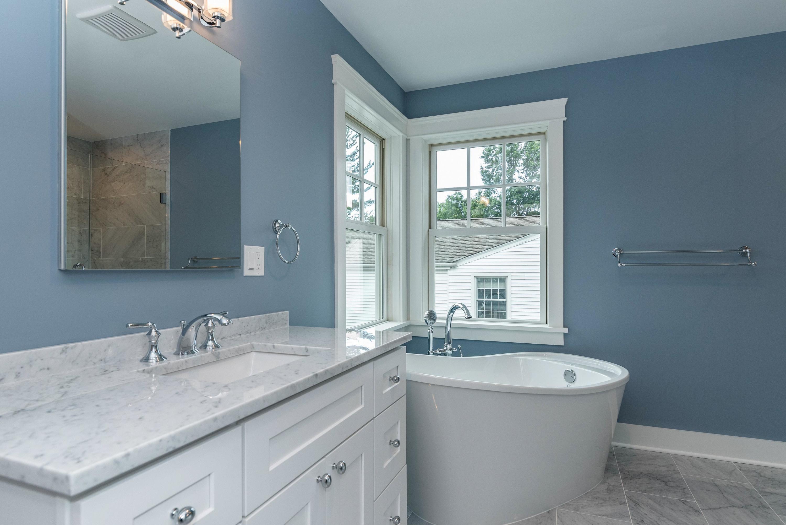37 Ridgeley Street Darien, CT 06820 - Photo 13 of 24 a bathroom with a granite countertop sink mirror and a bathtub