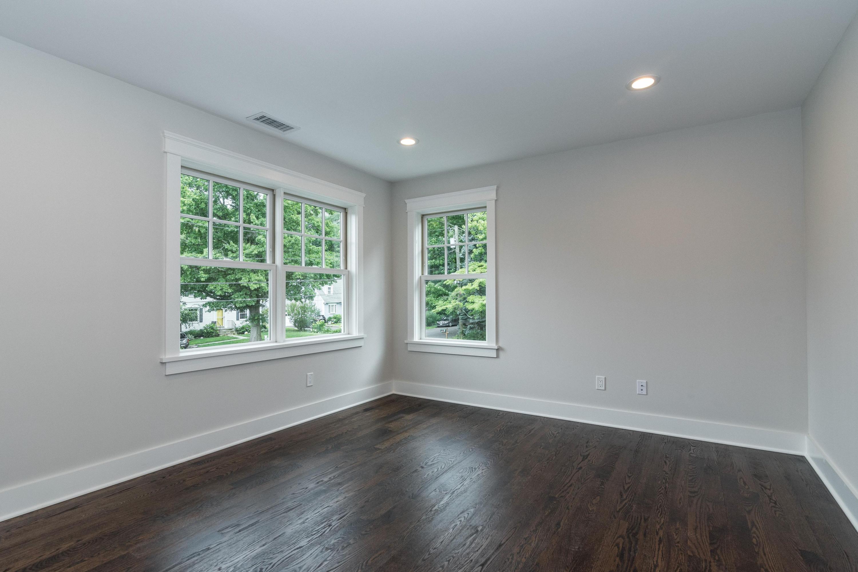 37 Ridgeley Street Darien, CT 06820 - Photo 14 of 24 a view of an empty room with wooden floor and a window